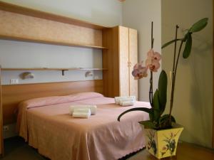 Postel nebo postele na pokoji v ubytování Hotel Parma Mare