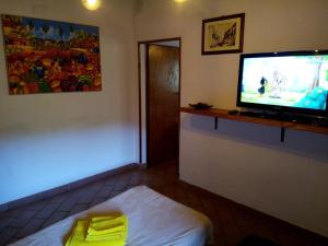A television and/or entertainment centre at Appartamento Martina