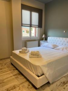 A bed or beds in a room at Galaxidi Sea View Apartment , Galaxidi