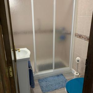 a bathroom with a shower with a toilet and a sink at Apartamentos Candelarita in Gran Tarajal