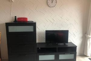 Televízia a/alebo spoločenská miestnosť v ubytovaní Groot appartement in Aparthotel met prachtig uitzicht