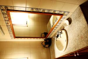 a bathroom with a sink and a mirror at Casa Da Peneda in Geres