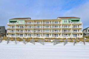 a large apartment building on the beach in the snow at Cabana Club 208 in Destin