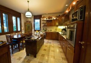a large kitchen with a table and a dining room at Villa Liberty in Venice-Lido