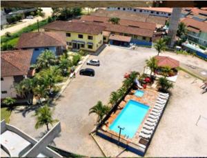 an aerial view of a resort with a swimming pool at Associação Sabesp Bertioga - SP in Bertioga