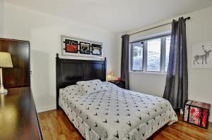 Giường trong phòng chung tại Condo 517 Chemin du Hibou by Les Chalets Alpins