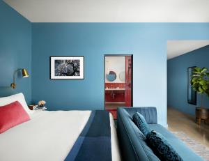 Voodi või voodid majutusasutuse The Ruby Hotel toas