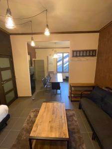 a living room with a table and a couch at J and R Brussels City Apartment in Brussels