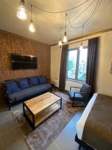 Et sittehjørne på J and R Brussels City Apartment