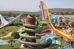 a water park with a roller coaster and slides at Ria Center Apartment - Right in Faro