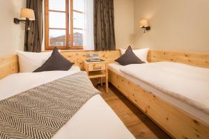Postel nebo postele na pokoji v ubytování Hotel Weinbauer