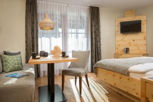 Postel nebo postele na pokoji v ubytování Hotel Weinbauer