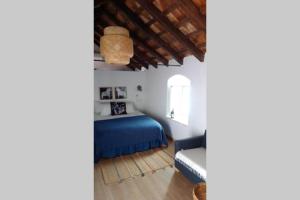 Ein Bett oder Betten in einem Zimmer der Unterkunft La Puerta Azul