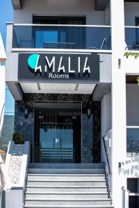 a building with a sign that reads amala rooms at Amalia Rooms Sea View in Nea Vrasna