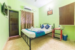 Postel nebo postele na pokoji v ubytování Kiara Hotel Goa