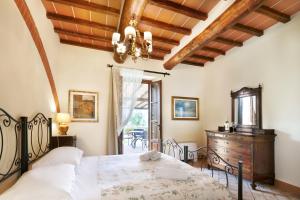Postel nebo postele na pokoji v ubytování Agriturismo Podere Casato