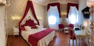 a bedroom with a bed and a dresser at Savoia & Jolanda in Venice