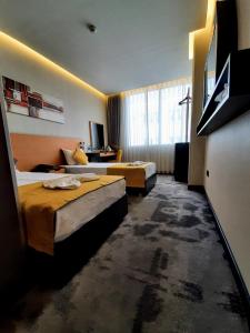 Postel nebo postele na pokoji v ubytování Sapko Airport Hotel + 36 fotografií