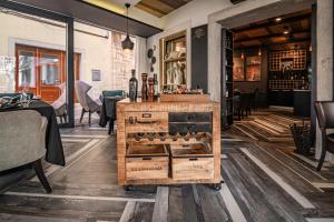 a bar with a wooden cart with wine bottles at Bed and Brekfast Donatella in Piran