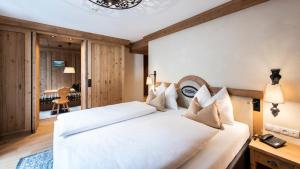 Posteľ alebo postele v izbe v ubytovaní Alpenhotel Kramerwirt