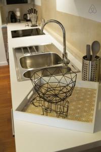 a kitchen sink with a metal faucet in a kitchen at Pretty 3 rooms in the city center in Annecy