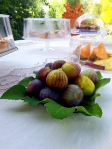 a pile of fruits and vegetables on a table at Terre Di Vendicari in Noto