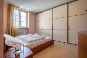 Posteľ alebo postele v izbe v ubytovaní Attico la Rocca