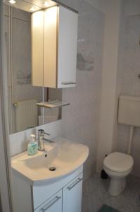 Kúpeľňa v ubytovaní Rooms & Apartments Kvasić