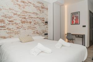 A bed or beds in a room at Pension H30 SALCES Licencia HBI01292