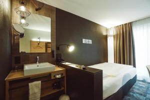 Postelja oz. postelje v sobi nastanitve Baxter Hotel