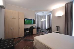 Posteľ alebo postele v izbe v ubytovaní Hotel Vittoria