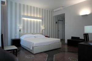 Posteľ alebo postele v izbe v ubytovaní Hotel Vittoria