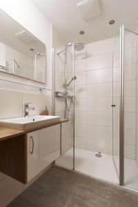 a bathroom with a shower and a sink at Apart Life in Sölden