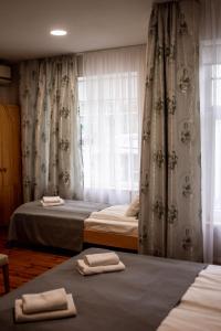Postel nebo postele na pokoji v ubytování Sunset Hotel