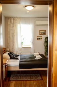 Postel nebo postele na pokoji v ubytování Sunset Hotel