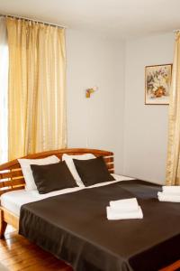 Postel nebo postele na pokoji v ubytování Sunset Hotel