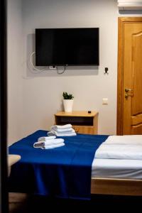Postel nebo postele na pokoji v ubytování Sunset Hotel