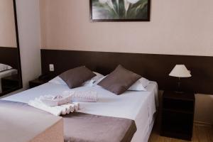 Een bed of bedden in een kamer bij Alzira Granada Hotel