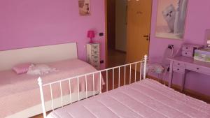 a childs bedroom with a bed and a dresser at Gufo Azzurro in Sulmona