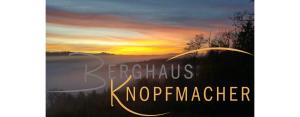 Berghaus Knopfmacher في Fridingen an der Donau: a book cover of a sunrise with the words kerksh noeper