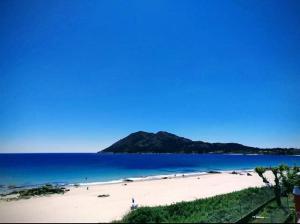 a view of a beach with a mountain in the background at HOSTAL FORMOSO in San Francisco