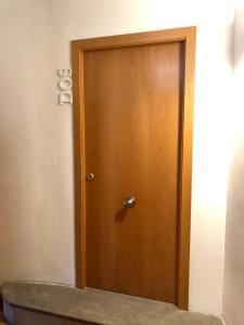 a wooden door in the corner of a room at Diana 16 in Denia +7 photos