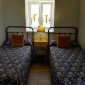 מיטה או מיטות בחדר ב-Casa Lela I