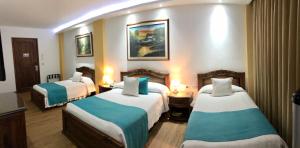 Ένα ή περισσότερα κρεβάτια σε δωμάτιο στο El Gran Hotel de Pereira