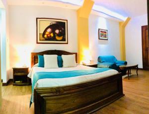 Ένα ή περισσότερα κρεβάτια σε δωμάτιο στο El Gran Hotel de Pereira