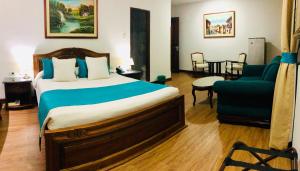 Ένα ή περισσότερα κρεβάτια σε δωμάτιο στο El Gran Hotel de Pereira