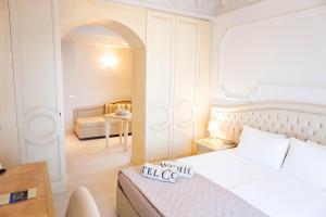 Postel nebo postele na pokoji v ubytování Hotel Conchiglia