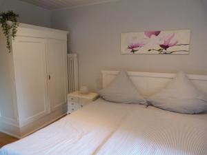 Postel nebo postele na pokoji v ubytování Gästezimmer Am Hüstert