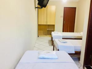 Postel nebo postele na pokoji v ubytování Hotel Oliveira