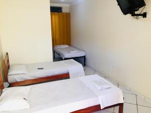 Postel nebo postele na pokoji v ubytování Hotel Oliveira